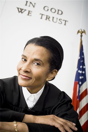 simsearch:640-01350504,k - Portrait of a female judge smiling Foto de stock - Sin royalties Premium, Código: 640-02764735