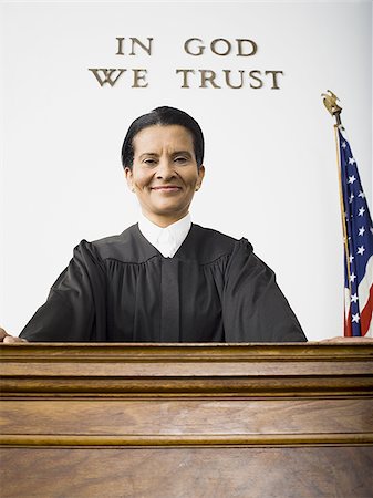 simsearch:640-01350504,k - Portrait of a female judge smiling Foto de stock - Sin royalties Premium, Código: 640-02764733