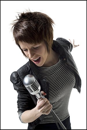 simsearch:640-01351921,k - A young woman singing into a microphone Foto de stock - Sin royalties Premium, Código: 640-02764805