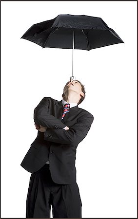 simsearch:640-02768599,k - Businessman balancing umbrella on his forehead Stock Photo - Premium Royalty-Free, Code: 640-02764814