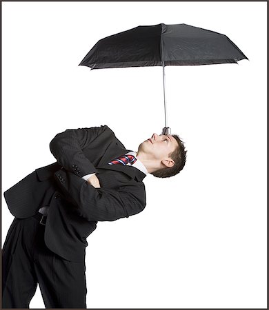 simsearch:640-02768599,k - Businessman balancing umbrella on his forehead Stock Photo - Premium Royalty-Free, Code: 640-02764816