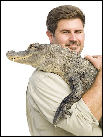 Animal handler with alligator Stock Photo - Premium Royalty-Free, Code: 640-02764936