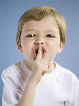 shhh - Closeup of boy hushing Stock Photo - Premium Royalty-Free, Code: 640-02765155