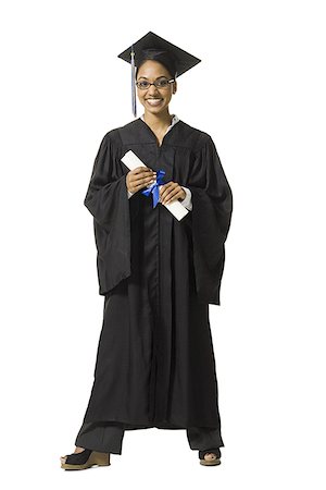 Woman in graduation gown and Blank Sign with diploma Stock Photo - Premium Royalty-Free, Code: 640-02765171