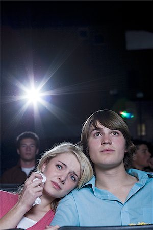 simsearch:640-02773406,k - Crying girl and smiling boy watching movie at theater Stock Photo - Premium Royalty-Free, Code: 640-02765182