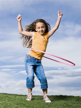 female latin dancers - Girl playing with hula hoop outdoors Stock Photo - Premium Royalty-Free, Code: 640-02765241