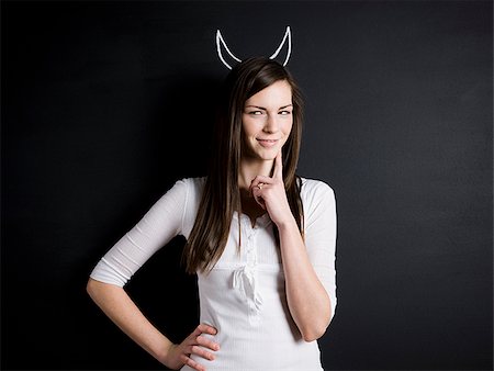 devil - woman with devil horns Stock Photo - Premium Royalty-Free, Code: 640-02765623