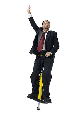 simsearch:640-01350815,k - Portrait of a businessman on a pogo stick Stock Photo - Premium Royalty-Free, Code: 640-02766447