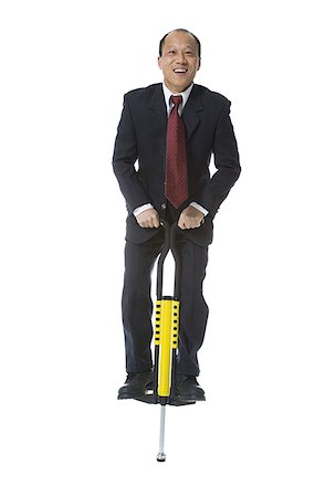 simsearch:640-01350815,k - Portrait of a businessman on a pogo stick Stock Photo - Premium Royalty-Free, Code: 640-02766448