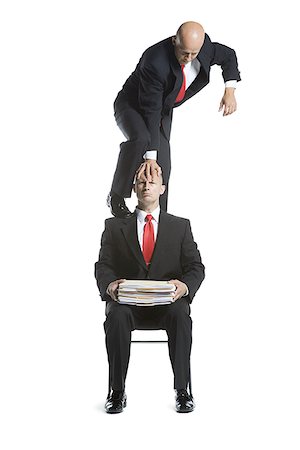 Two male acrobats in business suits performing Stock Photo - Premium Royalty-Free, Code: 640-02766658
