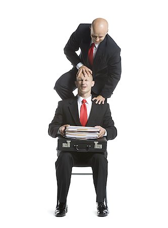 Two male acrobats in business suits performing Stock Photo - Premium Royalty-Free, Code: 640-02766659