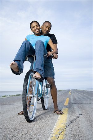 simsearch:640-02767388,k - Portrait of a young couple sitting on a bicycle Stock Photo - Premium Royalty-Free, Code: 640-02766730