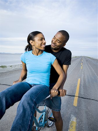 simsearch:640-02767388,k - Young couple sitting on a bicycle Stock Photo - Premium Royalty-Free, Code: 640-02766731