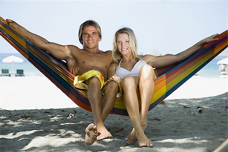 simsearch:695-03374346,k - Portrait of a young couple sitting in a hammock Stock Photo - Premium Royalty-Free, Code: 640-02766854