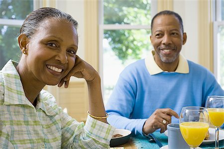 elder woman table - Portrait of a senior man and a senior woman sitting at the breakfast table Stock Photo - Premium Royalty-Free, Code: 640-02766869