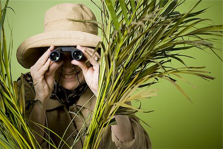 simsearch:640-02768330,k - Close-up of an elderly woman looking through a pair of binoculars Stock Photo - Premium Royalty-Free, Code: 640-02767054