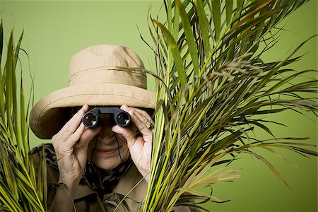 simsearch:640-02768330,k - Close-up of an elderly woman looking through a pair of binoculars Stock Photo - Premium Royalty-Free, Code: 640-02767053