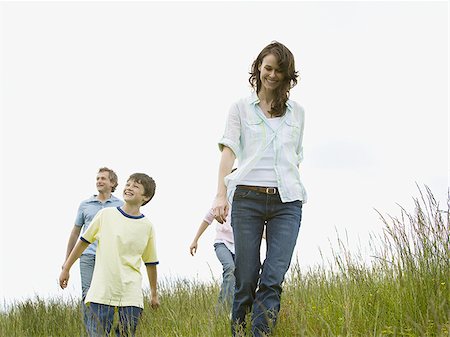 simsearch:640-02767291,k - Low angle view of a woman and a man with their son and daughter in a field Stock Photo - Premium Royalty-Free, Code: 640-02767266