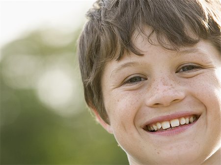 Portrait of a boy smiling Stock Photo - Premium Royalty-Free, Code: 640-02767335