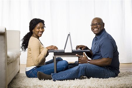 Portrait of a mature couple using laptops Stock Photo - Premium Royalty-Free, Code: 640-02767379