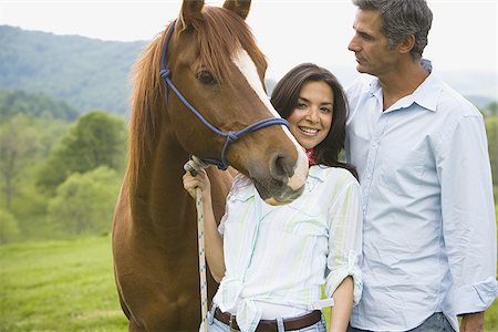 simsearch:640-01356213,k - Portrait of a woman holding the reins of a horse with a man beside her Stock Photo - Premium Royalty-Free, Code: 640-02767498