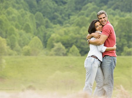 simsearch:640-02767388,k - Portrait of a man and a woman embracing each other Stock Photo - Premium Royalty-Free, Code: 640-02767542