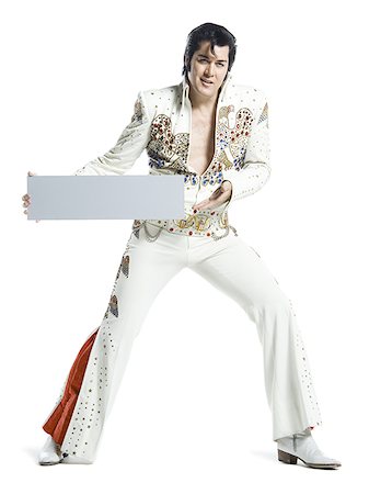 silhouette people performing - Portrait d'un imitateur d'Elvis tenant une pancarte blanche Photographie de stock - Premium Libres de Droits, Code: 640-02767609
