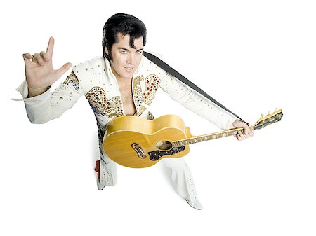 silhouette people performing - Portrait généraux d'un imitateur d'Elvis tenant une guitare Photographie de stock - Premium Libres de Droits, Code: 640-02767615