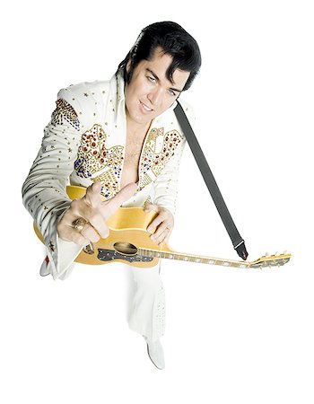 silhouette people performing - Portrait généraux d'un imitateur d'Elvis tenant une guitare Photographie de stock - Premium Libres de Droits, Code: 640-02767617