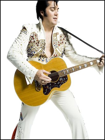 silhouette people performing - Portrait généraux d'un imitateur d'Elvis tenant une guitare Photographie de stock - Premium Libres de Droits, Code: 640-02767618
