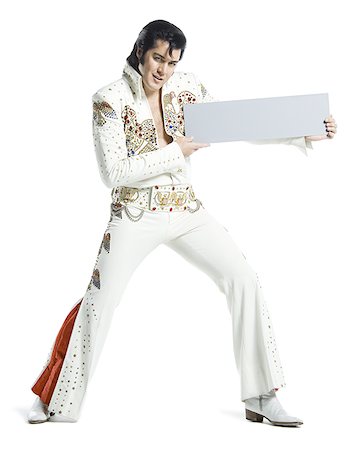 silhouette people performing - Portrait d'un imitateur d'Elvis tenant une pancarte blanche Photographie de stock - Premium Libres de Droits, Code: 640-02767611