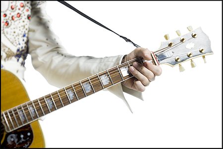 silhouette people performing - Gros plan d'un imitateur d'Elvis jouer de la guitare Photographie de stock - Premium Libres de Droits, Code: 640-02767621
