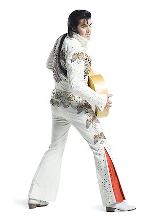 do - An Elvis impersonator holding a guitar Stock Photo - Premium Royalty-Free, Code: 640-02767623