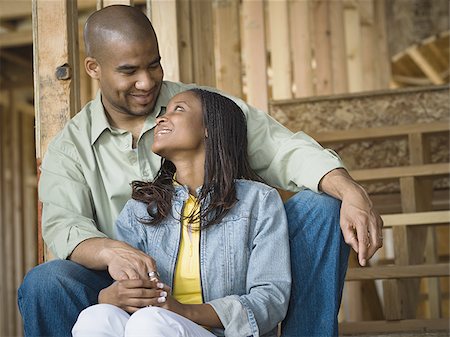 simsearch:640-02764709,k - Portrait of a young couple sitting and smiling Stock Photo - Premium Royalty-Free, Code: 640-02767674