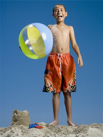simsearch:640-02767716,k - Portrait of a boy holding a beach ball Stock Photo - Premium Royalty-Free, Code: 640-02767721