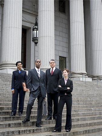 simsearch:640-02767805,k - Low angle view of lawyers standing on the steps of a courthouse Stock Photo - Premium Royalty-Free, Code: 640-02767787