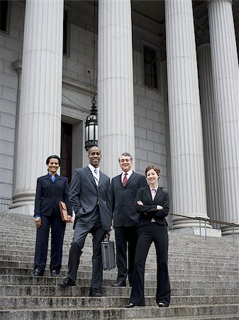 simsearch:640-02767805,k - Low angle view of lawyers standing on the steps of a courthouse Stock Photo - Premium Royalty-Free, Code: 640-02767789