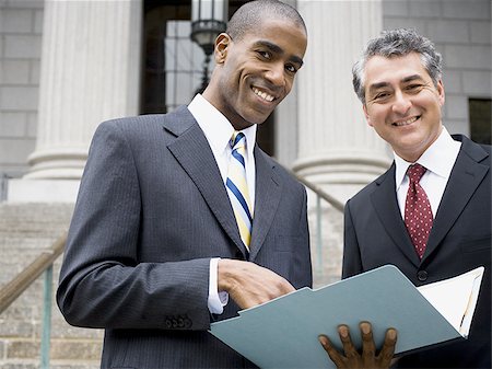 simsearch:640-02767805,k - Low angle view of two lawyers smiling Stock Photo - Premium Royalty-Free, Code: 640-02767797
