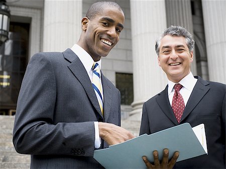 simsearch:640-02767805,k - Low angle view of two lawyers smiling Stock Photo - Premium Royalty-Free, Code: 640-02767798