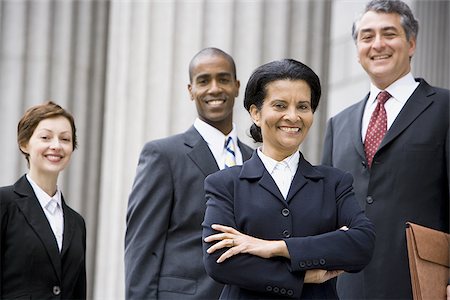 simsearch:640-02767805,k - Portrait of  lawyers smiling in front of a courthouse Stock Photo - Premium Royalty-Free, Code: 640-02767804