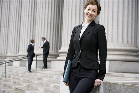 simsearch:640-02767805,k - Portrait of a female lawyer smiling Stock Photo - Premium Royalty-Free, Code: 640-02767806