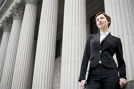 simsearch:640-02767805,k - Low angle view of a female lawyer standing in front of a courthouse Stock Photo - Premium Royalty-Free, Code: 640-02767809