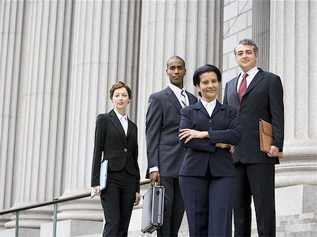 simsearch:640-02767805,k - Portrait of  lawyers smiling in front of a courthouse Stock Photo - Premium Royalty-Free, Code: 640-02767802