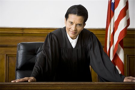 simsearch:640-01350504,k - Portrait of a female judge leaning against a bench Foto de stock - Sin royalties Premium, Código: 640-02767839