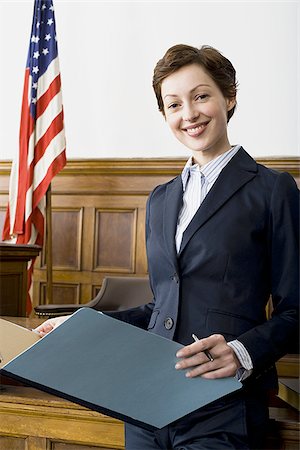 simsearch:640-02767805,k - Portrait of a female lawyer standing in a courtroom Stock Photo - Premium Royalty-Free, Code: 640-02767841