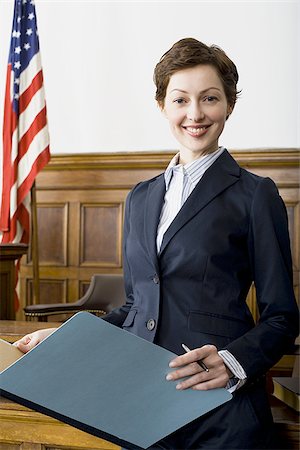 simsearch:640-02767805,k - Portrait of a female lawyer standing in a courtroom Stock Photo - Premium Royalty-Free, Code: 640-02767842
