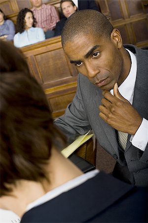 simsearch:640-01351636,k - High angle view of a male lawyer in a courtroom during a trial Foto de stock - Sin royalties Premium, Código: 640-02767864