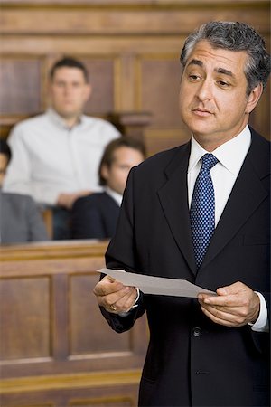 simsearch:640-01351636,k - Close-up of a male lawyer talking in a courtroom Stock Photo - Premium Royalty-Free, Code: 640-02767874