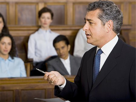 simsearch:640-01351636,k - A male lawyer talking in a courtroom Foto de stock - Sin royalties Premium, Código: 640-02767871