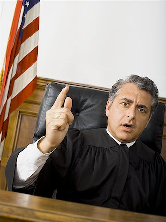 simsearch:640-01351636,k - Portrait of a male judge pointing Foto de stock - Sin royalties Premium, Código: 640-02767894